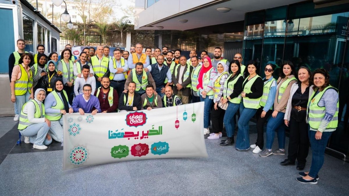 موظفو أمان وريفي وتمويلي يشاركون في شراء وتوزيع《شنط رمضان》
