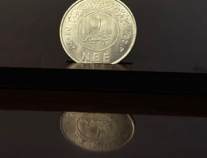 البنك الأهلي المصري يصدر طابع بريد وعملة تذكارية تحملان اسم وشعار البنك  